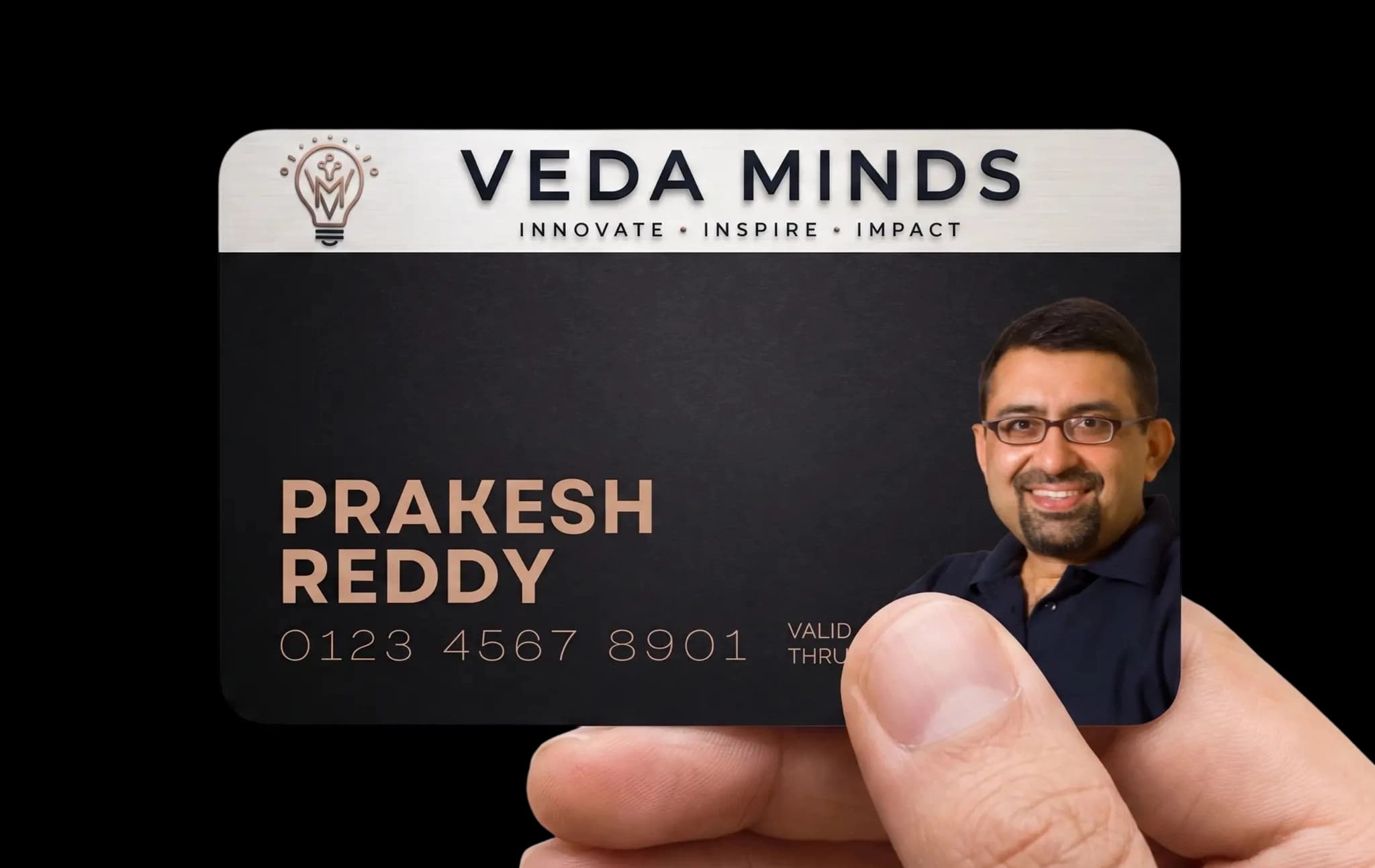 A hand holding the Veda Minds Benefits Card
